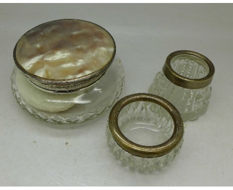 Two silver rimmed salts and a silver and mother of pearl topped powder jar hallmarked Birmingham 1927