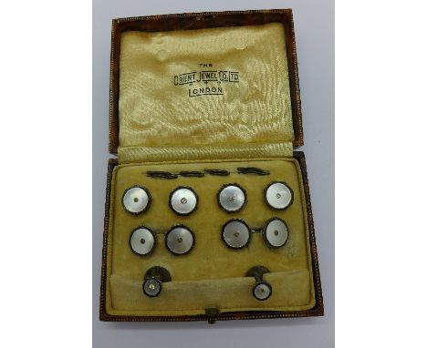 A cased cufflinks and stud set