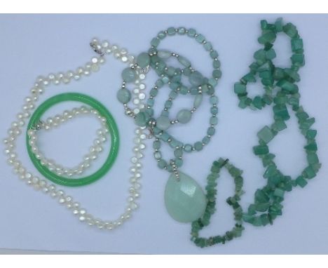 A silver mounted aventurine necklace, a freshwater pearl necklace and bracelet, a bangle, etc.