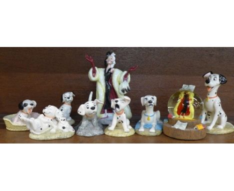 A collection of Disney 101 Dalmatians figures including Cruella de Vil and a Cruella de Vil glitter globe (9)