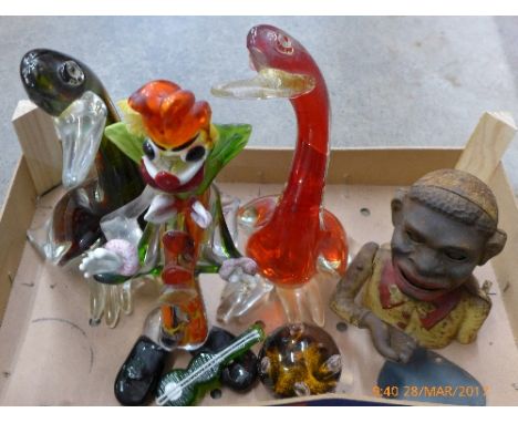 Two Murano glass ducks, one a/f, a Murano glass clown, a/f, a Caithness Moonflower paperweight and a money bank