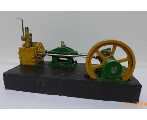 A stationary steam engine on a heavy metal base, 31cm