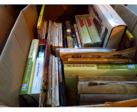 Shelf of Tarzan books and two comics 