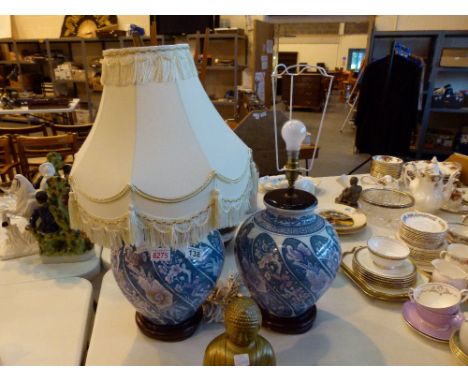 Pair of ceramic lamp bases in an oriental style with one lampshade
