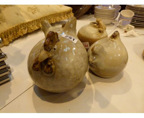 Three ceramic chickens and a frog 