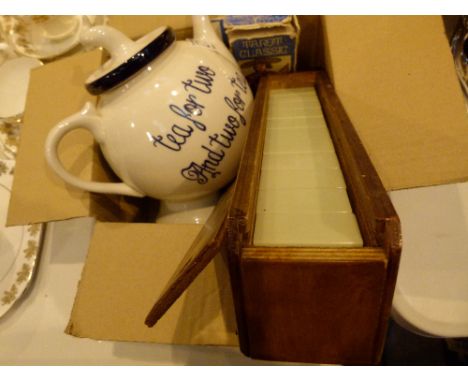 Teapot, set of nines dominoes and a tarot card set 
