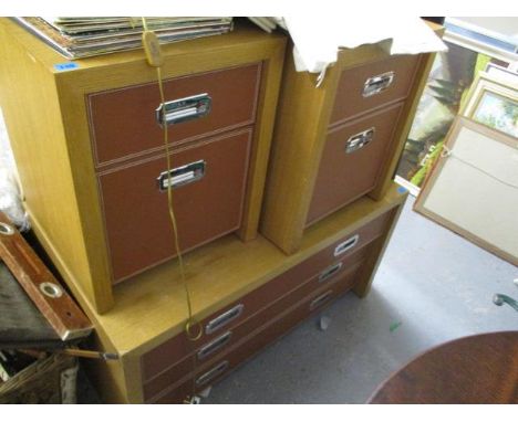 A modern light oak low chest of drawers having leather fronted drawers, 23" h x 43" w and a pair of matching bedside tables, 