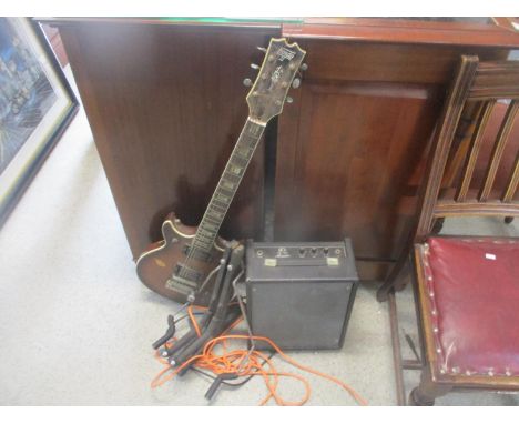 A Hondo II electric guitar, an Arbiter guitar stand and an Akays 10 amplifier 