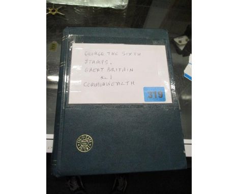 A stamp album containing George VI stamps, along with Great Britain and Commonwealth 