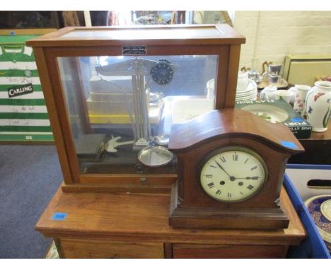 An early 20th century mahogany cased mantle clock, a mahogany and glazed cased chemists scales and a part dinner service 