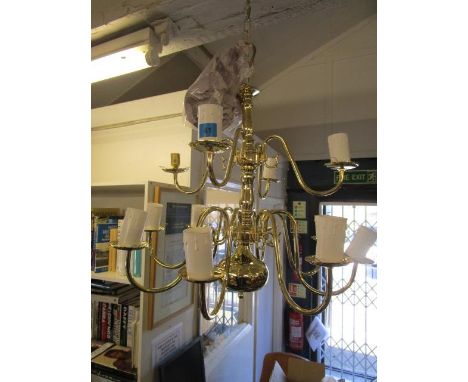 A brass effect twelve branch ceiling light 