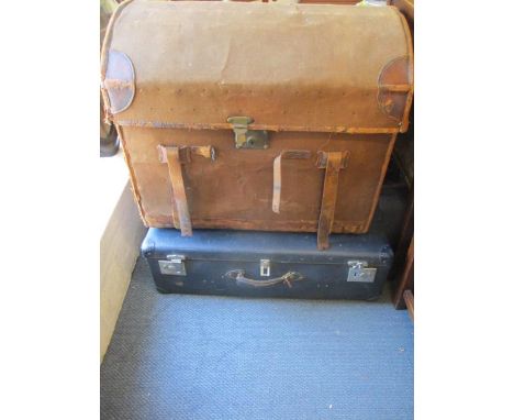 A domed steamer trunk together with a Globe Trotter suitcase 