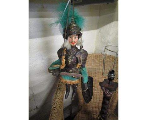 A vintage metal armour knight puppet, marionette 