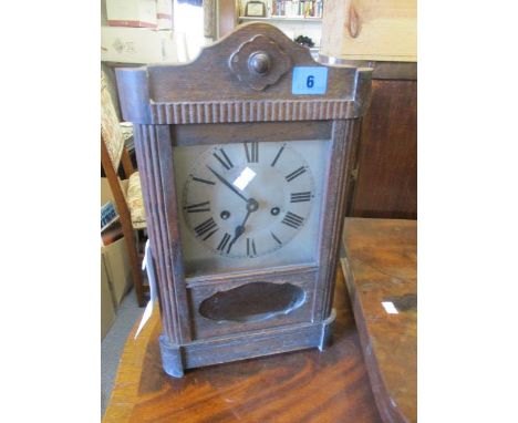 Circa 1900 an oak cased mantle clock, 15 1/4" h x 9"w 