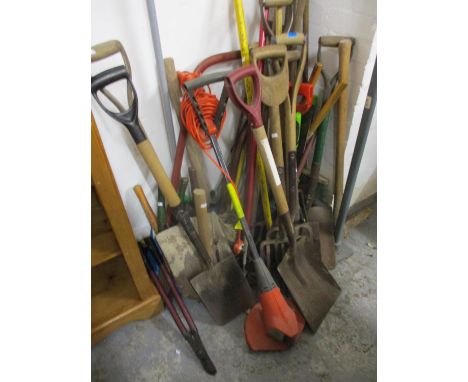 A selection of gardening tools to include forks and spades 