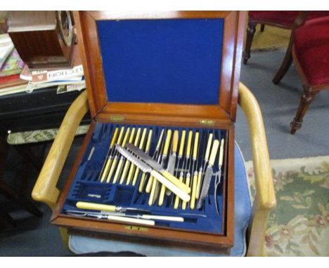 Silver plated fiddle pattern flatware and cutlery contained in a mahogany case 