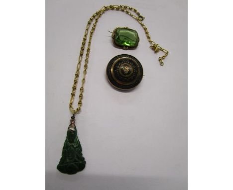 A Victorian inlaid, tortoiseshell brooch, a carved jade pendant on a yellow metal chain necklace and a green stone brooch set