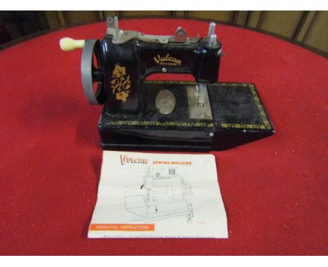 Vintage miniature Vulcan sewing machine with leaflet 