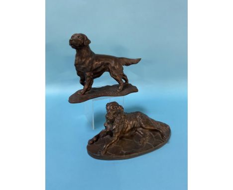 A cast bronze model of a retriever and another model