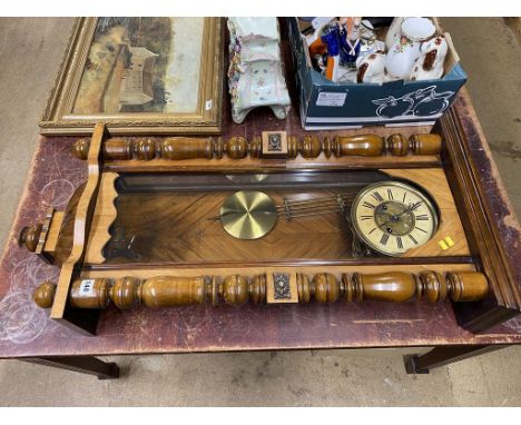 A walnut cased wall clock