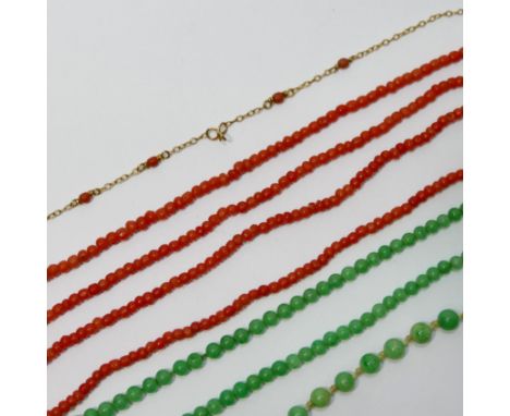 A yellow metal chain, stamped '9ct', incorporating four small coral beads, 45cm long, 2.2g gross, two coral necklaces, 42cm l