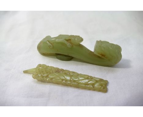 A 19th century Chinese jadeite belt hook, carved in the form of a dragon and gecko, 9cm long, and one other carved and pierce