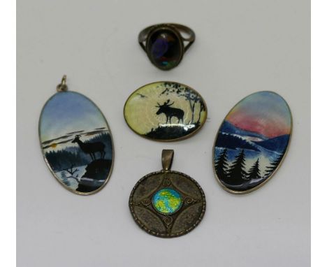 A silver and enamel circular pendant by Charles Horner, Chester 1908, 23mm diameter, a brooch and two pendants (one at fault)