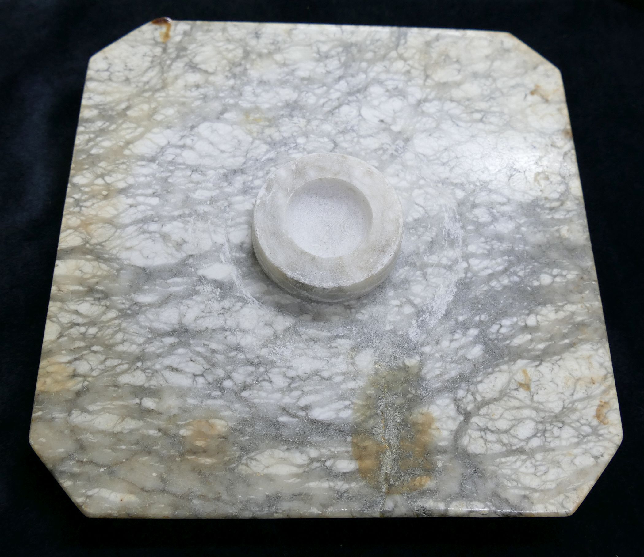 A white and grey mottled marble pedestal, with turned column, hexagonal ...