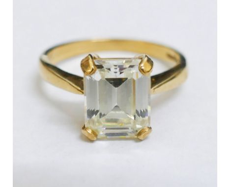 A 9 carat gold emerald cut single stone cubic zirconia ring, the white stone in four claw setting, 10mm x 8mm, 4.3g gross, fi