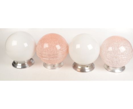Two pink mottled glass ceiling light shades, height 22cm, diameter 20cm and a pair of similar white opaque shades, height 22c