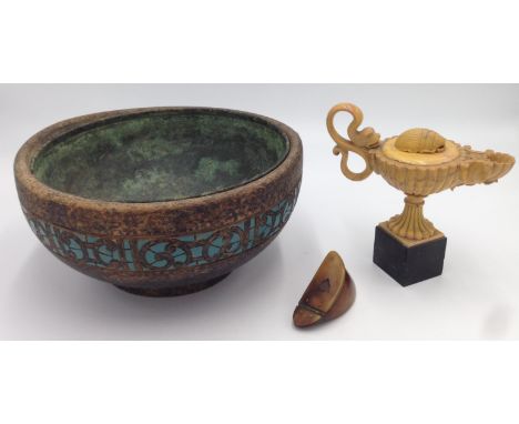 A treen bowl, with metal liner, impressed A.G.Reid to the base, height 12cm, diameter 24.5cm, a hardstone Aladdin's lamp and 