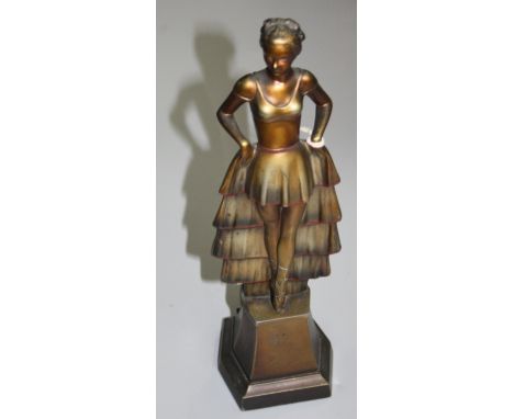 An Art Deco cold painted metal table lighter, in the form of a lady standing on a plinth, height 24.5cm. 