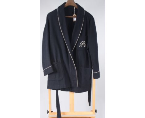 A Selfridges, navy wool smoking jacket with white cord piping and monogrammed with an 'R', length 91cm.