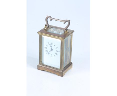 A brass carriage clock, height 11.3cm, width 8cm, depth 6cm. 