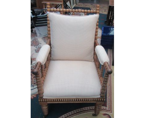 A Victorian mahogany bobbin turned library armchair, with a padded seat, height 96cm, width 61cm, depth 73cm.  Condition repo