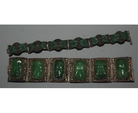 A Chinese filigree bracelet set with simulated jade panels and one other bracelet.