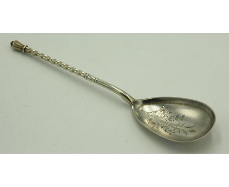 A continental silver spoon with twisted stem and urn finial, the bowl with engraved floral decoration. 