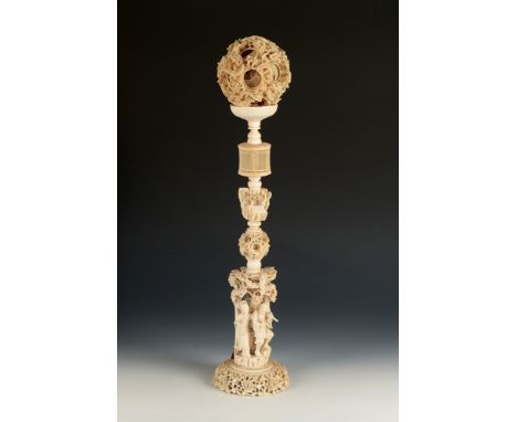 A Chinese Canton ivory concentric ball ornament, 1900-1920, finely carved and undercut with dragons and clouds with the inter