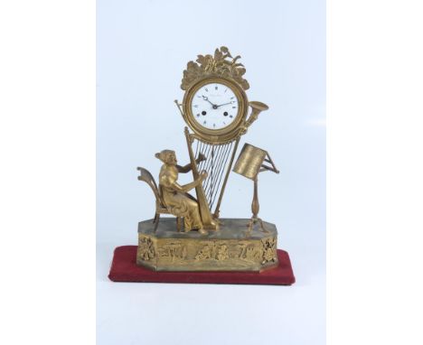 A good French Empire ormolou clock, the white enamel dial signed 'Philippe Duboia au Locle', above a lady at a harp, height 4