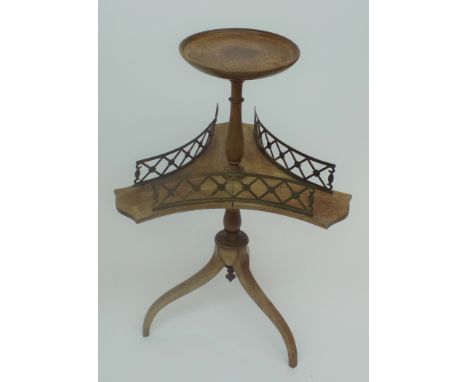 A mahogany and gilt metal mounted revolving two tier dumb waiter, with pierced galleries and tripod base, height 83cm.