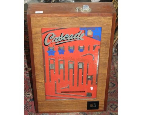 An early 20th century `Cascade` penny arcade machine by Bell-Fruit manufacturing Co Ltd, glass front enclosing a penny drop. 