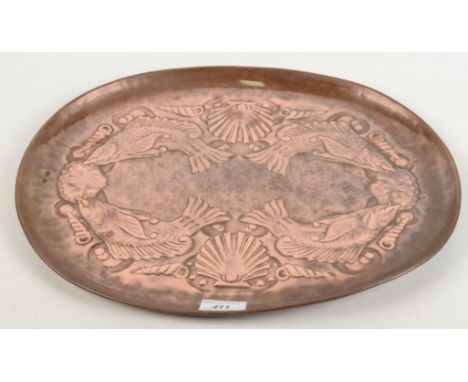 An Arts and Crafts oval copper tray, repousse decorated with stylised fish and shells, 33 x 42cm.