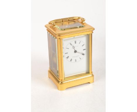 A good French gilt brass corniche cased carriage clock, the white dial signed Wilson &amp; Gandar 392 strand.