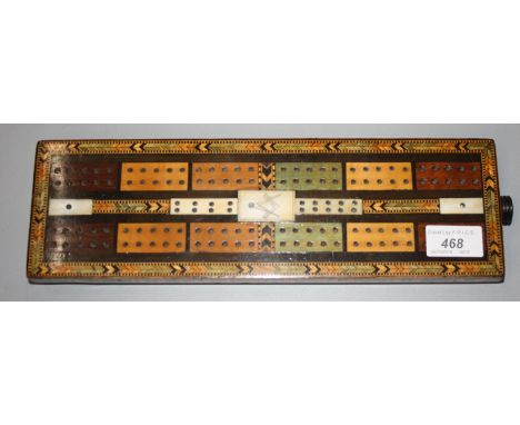 A Masonic parquetry inlaid cribbage board, 33 x 10cm.