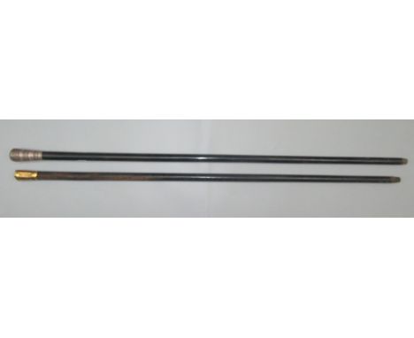 A silver topped engine turned ebonised walking cane, length 91cm and a gilt metal mounted presentation cane dated 1914, lengt