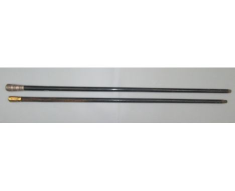 A silver topped engine turned ebonised walking cane, length 91cm and a gilt metal mounted presentation cane dated 1914, lengt