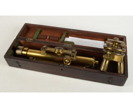 A Troughton &amp; Simms brass surveyor's level, together with an adjustable brass tripod plate.