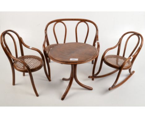 Bentwood dolls furniture comprising a circular centre table, height 27cm, diameter 27cm, a sofa, height 33cm, width 36.5cm, a