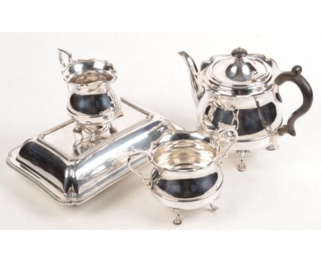 An EPNS three piece tea service on shell capped legs, together with an entree dish and a little cutlery.