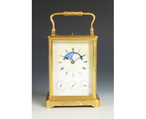 A late 19th century French moon phase repeating carriage clock, with gilt brass ornately engraved corniche case, with a silve